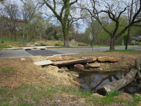 Part of the Broad Branch stream daylighting project, with a new road surface and sidewalk.
