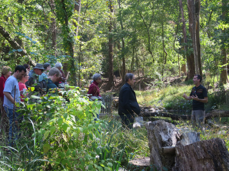 DOEE's Steve Saari, right, took attendees on a tour of the Broad Branch stream project area.
