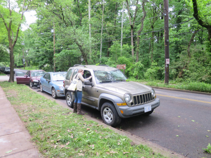 Mary Lou Jacobsen with damaged car
