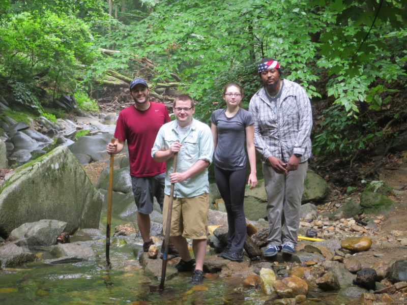 PATC Soapstone volunteer supervisor Devin Rhinerson, left, with volunteers. (photos by Marlene Berlin)
