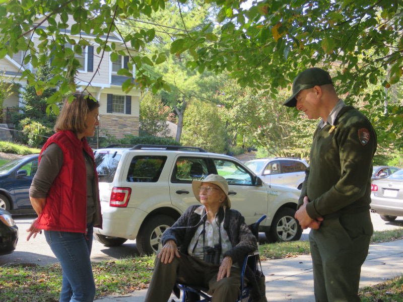 Katrina Weinig, left, talks with Forest Hills Connection's nature writer Marjorie Rachlin, center.