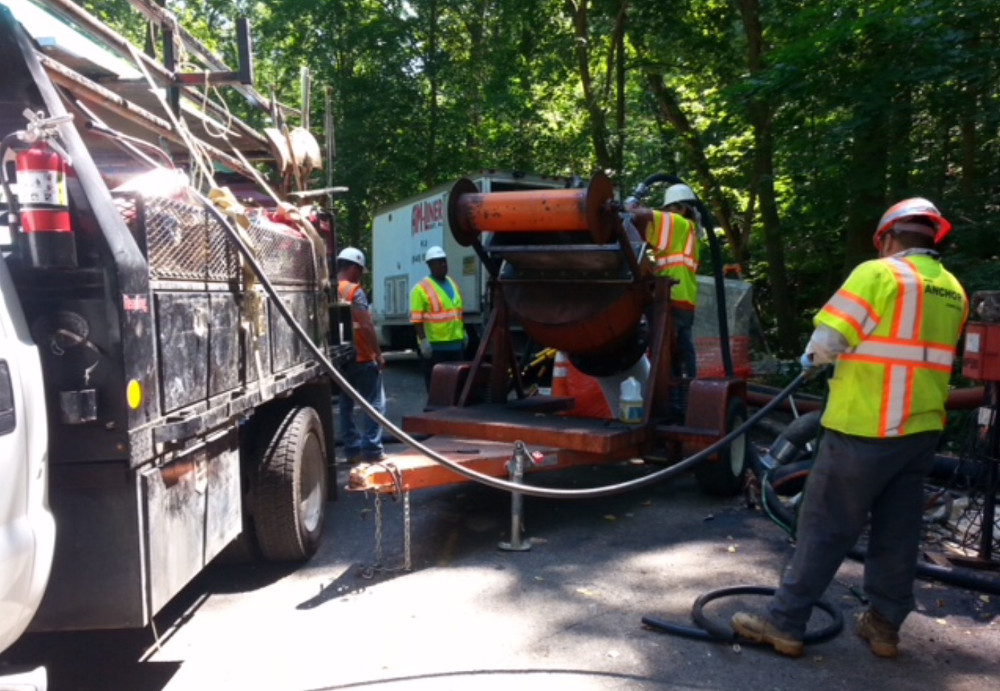 This machine would feed the warmed liner into pit using the compressed air hose. (photo by Marjorie Share)